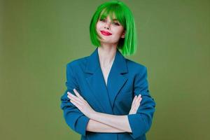 Positive young woman Glamor green wig red lips blue jacket studio model unaltered photo