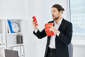 Man office work documents with a phone in hand technology photo