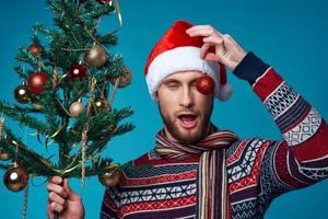 emotional man in a santa hat Christmas decorations holiday New Year isolated background photo