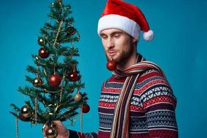 Cheerful man in New Year's clothes decoration christmas isolated background photo