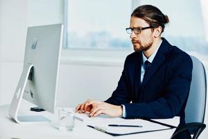 businessman work in front of a computer documents Lifestyle photo