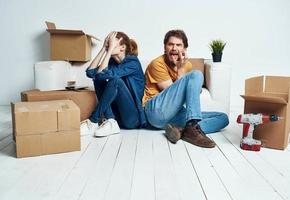 Man and woman with empty boxes Moving to an apartment indoor interior photo