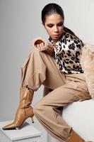 attractive woman in leopard shirt fashionable autumn clothes boots photo
