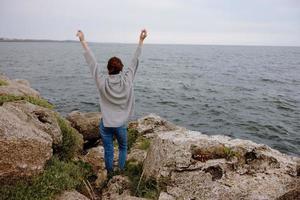 beautiful woman sweaters cloudy sea admiring nature Lifestyle photo