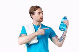 Cheerful man sport workout water bottle cropped view photo