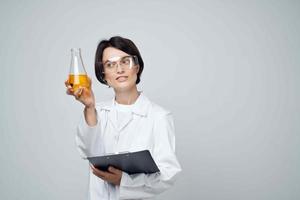 Cheerful woman laboratory assistant science research chemical solution photo