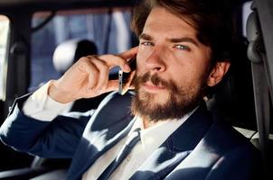 business man in the car talking on the phone passenger photo