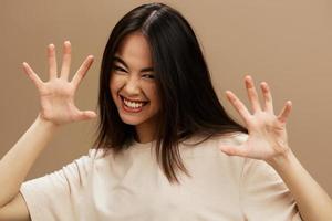 woman attractive look charmin in a t-shirt beige background photo