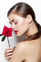 Girl with flower Closed eyes red lips photo