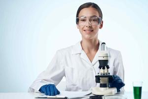 woman scientist laboratory microscope research biotechnology photo