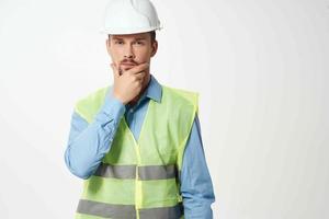 man reflective vest blueprints builder light background photo