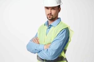 Male builder Professional working uniform light background photo