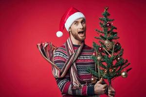 man in a sweater christmas tree toys decoration photo