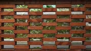 The roster brick arrangement is made hollow so that air can flow inside and create fresh air in the garden photo