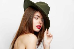 Woman portrait Green hat attractive look red lips photo