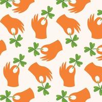 Seamless pattern with hands holding a four leaf clover.Vector hand drawn illustration. vector