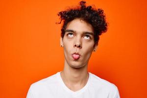 guy in white t-shirt curly hair cropped view studio photo