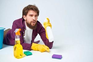 man with a bucket on the floor detergent service lifestyle photo