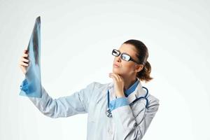 nurse looking at x-ray examination patient health photo