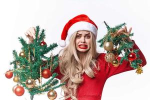 cheerful woman dressed as santa claus toys emotions gift christmas photo