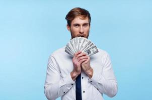 business man in shirt with tie bundle of money finance wealth photo