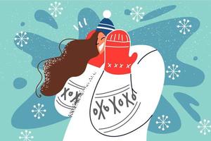 Smiling woman in outerwear enjoy winter holidays. Happy girl in hat and sweater relax walking in snow on vacations. Vector illustration.