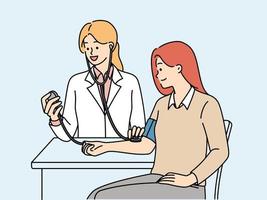 Woman undergoes medical examination at doctor using stethoscope and device for measuring blood pressure. Girl patient sitting at table near doctor undergoing physical examination vector