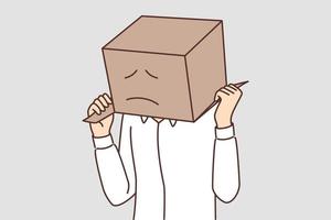 Man with cardboard box on head with painted sad face. Sad guy in white shirt hides head behind parcel for concept of problems with courier company or delivery service vector