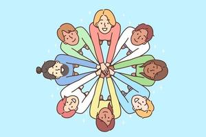 Multiracial people stand in circle with hands outstretched to demonstrate friendship. Men and women look up demonstrating multiracial diversity and national tolerance vector