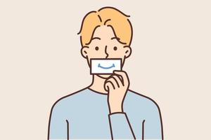 Man puts piece of paper with image of smile to mouth, wanting to fake positive emotions during stress. concept of fake emotions and trying to look successful in period of depression and bad mood vector