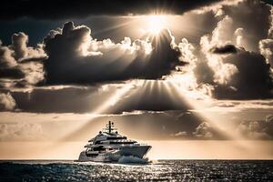 sailing sea yacht sails under the sun rays from the clouds photo