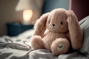 toy plush soft rabbit on the bed photo