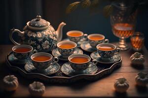 tea ceremony, teapot and ceramic mugs with drink photo