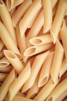 Penne lisce pasta food background photo