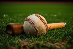 ball with a baseball bat on the grass photo