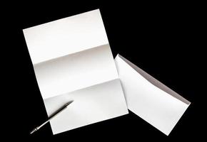 blank of letter paper and white envelope with pen photo
