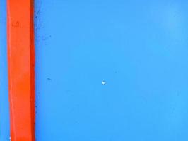 Plain walls that have two colors, namely blue and orange photo