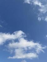 Cloudscape on blue sky background photo