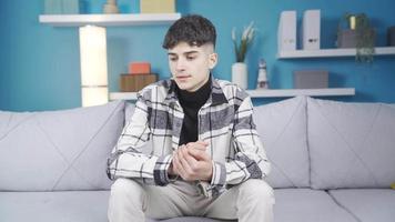 Young man with problems. Depressed. Thinking about his problems, the young man cannot solve them and gets depressed. video