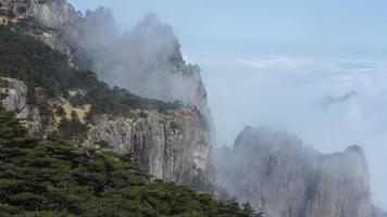 The beautiful mountains landscapes with the green forest and the erupted rock cliff as background in the countryside of the China photo