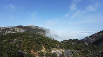 The beautiful mountains landscapes with the green forest and the erupted rock cliff as background in the countryside of the China photo