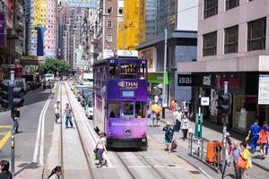 HONG KONG - JUNE 08-Public transport on the street on JUNE 08, 2015 in Hong Kong. daily travelers use public transport. Trams also a major tourist attraction. photo