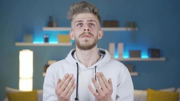 Muslim Young Man Praying, Islam. Religious young man praying, wishing well. video