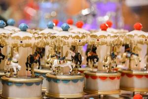 Miniature Musical carousel with horses, merry-go-round toy. photo