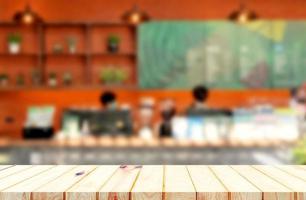 brown wooden board over blurred coffee shop photo