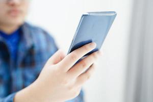 Asian teenage using mobile application in digital smartphone technology for learning. photo