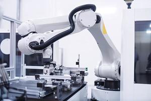 industrial machine robot, smart modern factory automation using advanced machines, industrial 4.0 manufacturing process photo