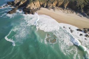 drone view of beach with waves and turquoise water photo