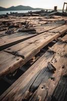 antiguo de madera muelle en el playa a puesta de sol. selectivo atención foto