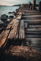 antiguo de madera muelle en el playa a puesta de sol. selectivo atención foto